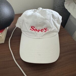 White Cap with Red “Sorry” Embroidery